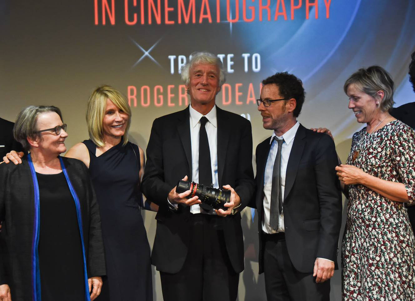 Posing at the ceremony honoring Roger Deakins, ASC, BSC, are (from left): director Agnieszka Holland, James and Roger Deakins, director Ethan Coen and actor Frances McDormand. (Credit: Angenieux/Pauline Maillet)