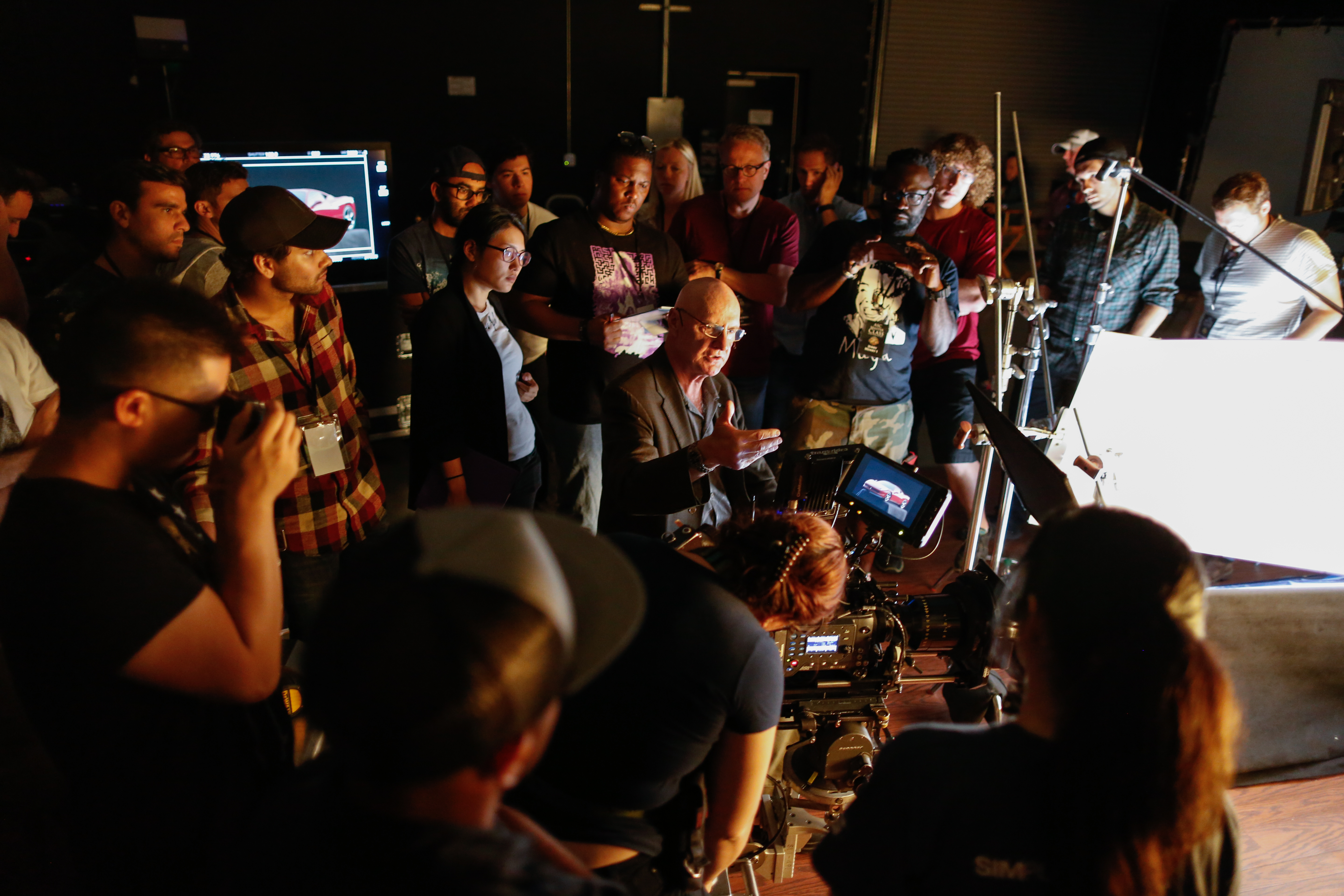 Bill Bennett, ASC lectures on the set of commercial photography.