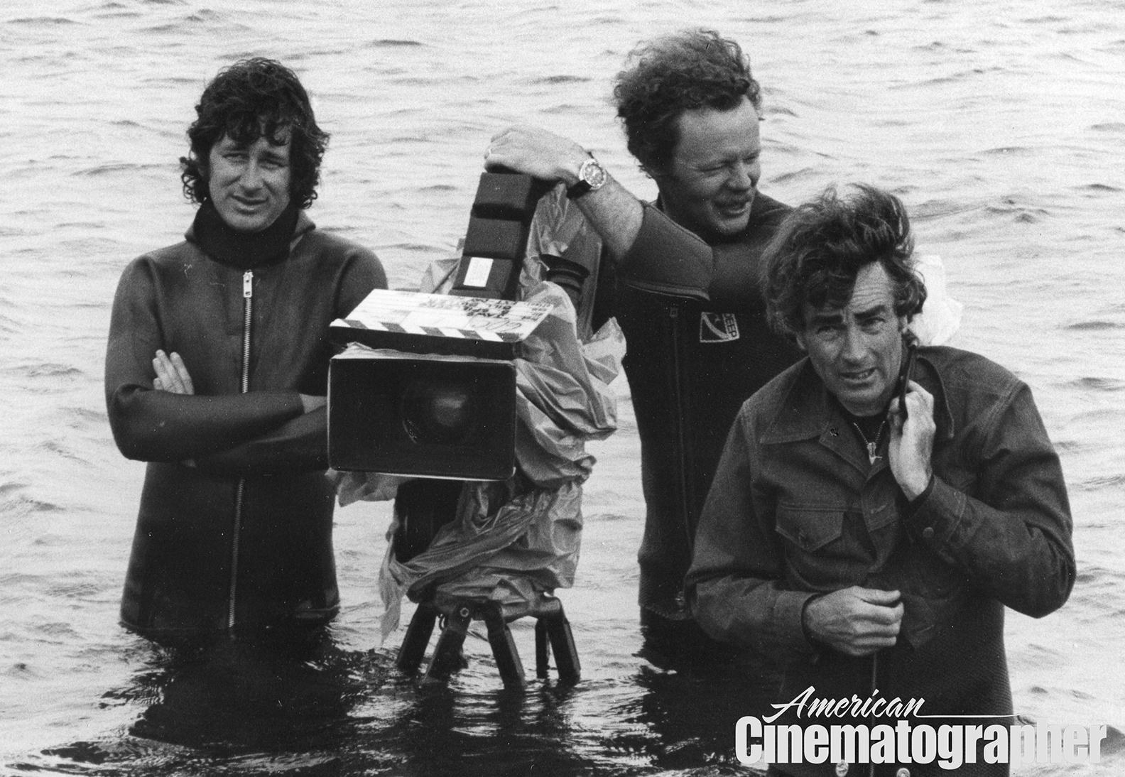 Director Steven Spielberg, operator Michael Chapman and cinematographer Bill Butler, ASC — braving the waves during the lengthy production of Jaws (1975).