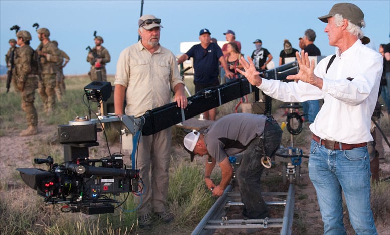 Roger Deakins sets up a shot with Key Grip Mitch Lillian on set of Sicario