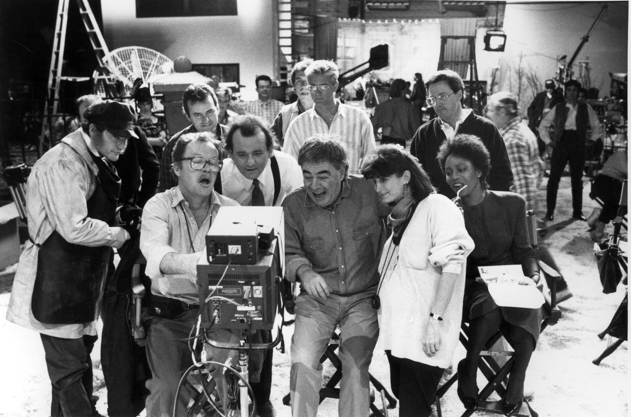 While filming the comedy Scrooged (1988), with star Bill Murray and director Richard Donner.